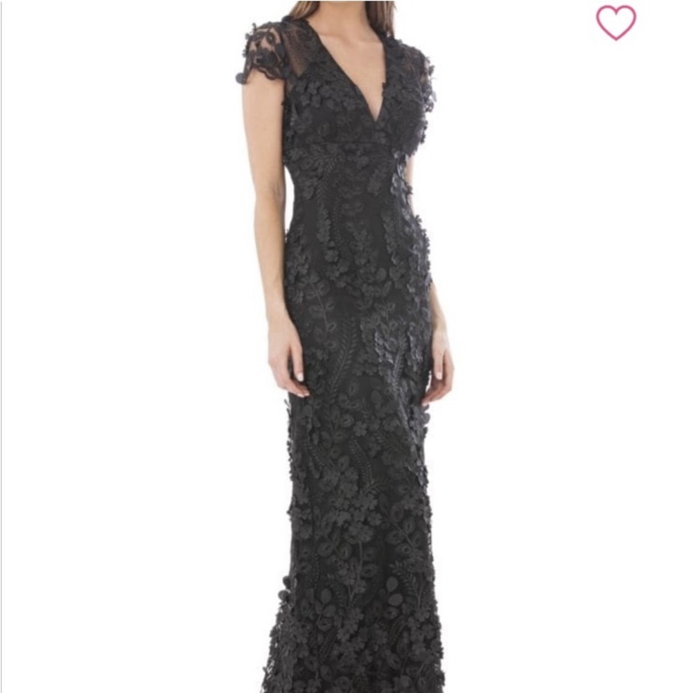 Black lined gown with lace flower appliqués. Mermaid, cap sleeves